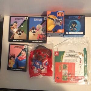 Happy Meal toys from McDonald's and a kids toy from Chick-fil-A